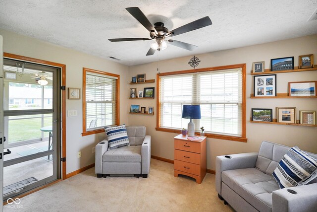 4001 Oakfield Dr, Indianapolis, IN 46237 - living area featuring a ceiling fan, light colored carpet, and a textured ceiling