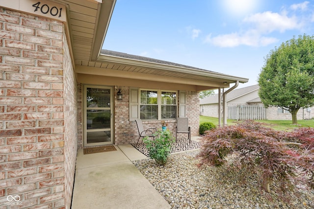 4001 Oakfield Dr, Indianapolis, IN 46237 - entrance to property featuring brick siding, covered porch, and a shingled roof