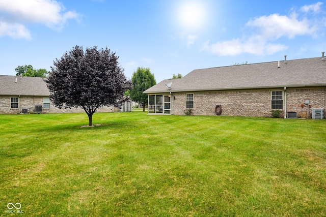 4001 Oakfield Dr, Indianapolis, IN 46237 - view of green lawn featuring a sunroom