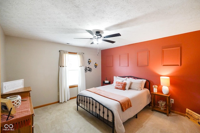 4001 Oakfield Dr, Indianapolis, IN 46237 - bedroom featuring light carpet, ceiling fan, and a textured ceiling