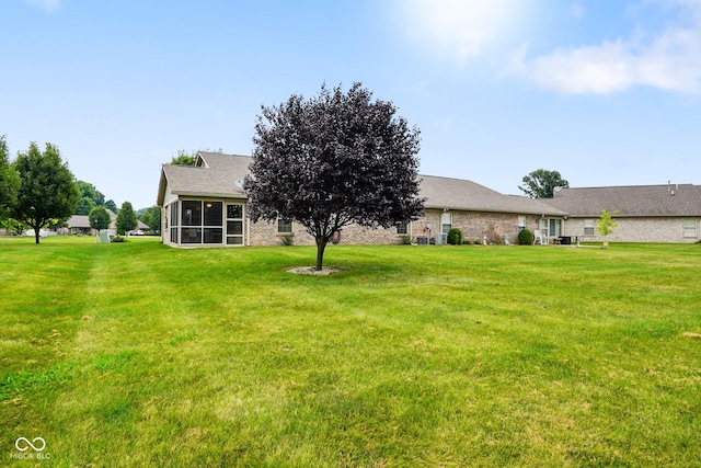 4001 Oakfield Dr, Indianapolis, IN 46237 - back of property with a sunroom and a yard
