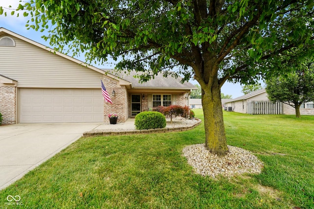4001 Oakfield Dr, Indianapolis, IN 46237 - view of front of house featuring brick siding, concrete driveway, and an attached garage