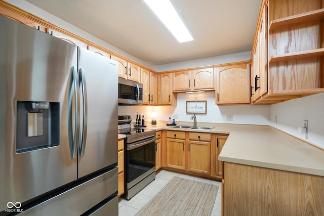4001 Oakfield Dr, Indianapolis, IN 46237 - kitchen with appliances with stainless steel finishes, open shelves, light tile patterned floors, light countertops, and light brown cabinets