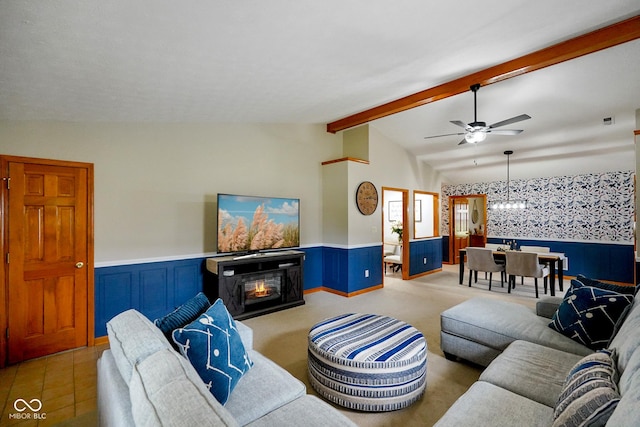 4001 Oakfield Dr, Indianapolis, IN 46237 - living area featuring a wainscoted wall, a lit fireplace, and a ceiling fan