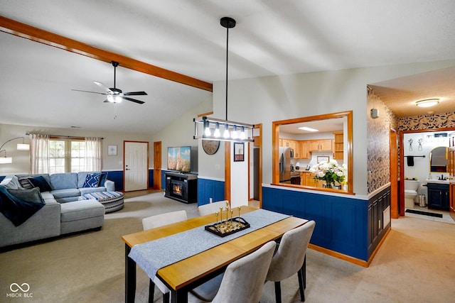 4001 Oakfield Dr, Indianapolis, IN 46237 - dining area with light colored carpet, wainscoting, and a ceiling fan