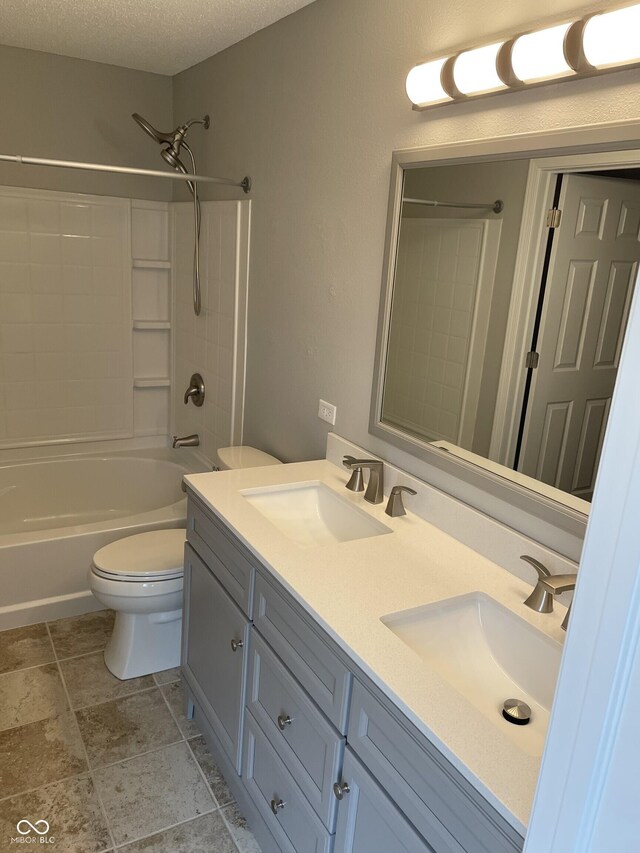 9701 W Constellation Dr, Pendleton, IN 46064 - full bath with double vanity,  shower combination, a textured ceiling, and stone finish flooring