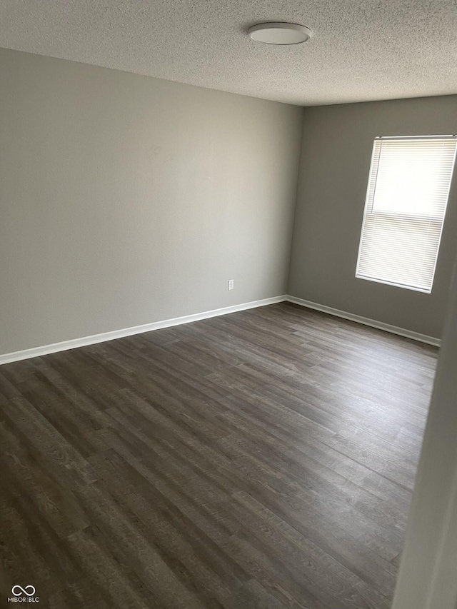 9701 W Constellation Dr, Pendleton, IN 46064 - unfurnished room featuring dark wood-style floors and a textured ceiling