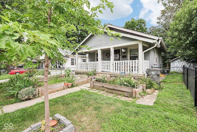 2933 S E St, Indianapolis, IN 46225 - bungalow-style house with a porch and a garden