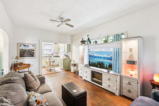 2933 S E St, Indianapolis, IN 46225 - living area with ceiling fan, hardwood / wood-style floors, and arched walkways