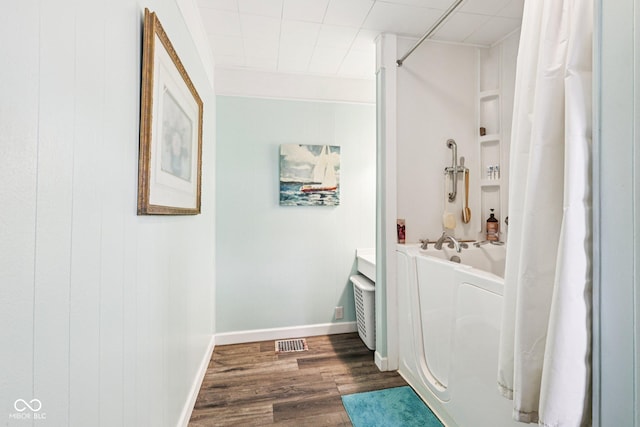 2933 S E St, Indianapolis, IN 46225 - full bathroom with wood finished floors, shower / bathtub combination with curtain, and vanity
