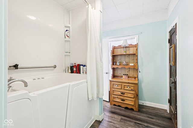 2933 S E St, Indianapolis, IN 46225 - bathroom with a bath, wood finished floors, and a shower with curtain