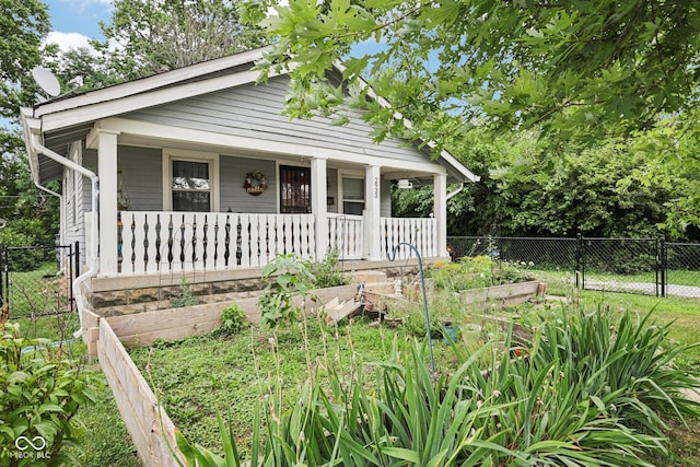 2933 S E St, Indianapolis, IN 46225 - view of front of property with covered porch, a garden, and a gate