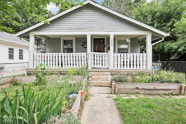 2933 S E St, Indianapolis, IN 46225 - view of front of property with covered porch and a garden