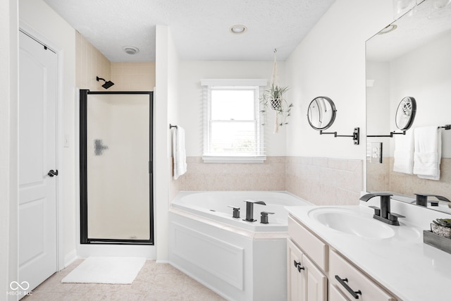 2025 W Morse Dr, Cicero, IN 46034 - bathroom with a shower stall, a bath, vanity, a textured ceiling, and tile patterned floors