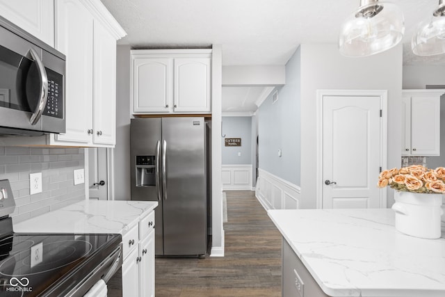 2025 W Morse Dr, Cicero, IN 46034 - kitchen featuring appliances with stainless steel finishes, dark wood-style floors, white cabinets, light stone counters, and wainscoting