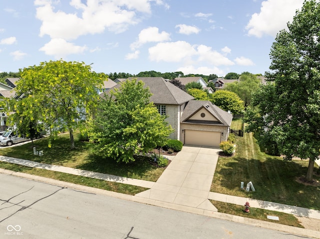 2025 W Morse Dr, Cicero, IN 46034 - view of front of home featuring an attached garage, concrete driveway, a front yard, and a residential view