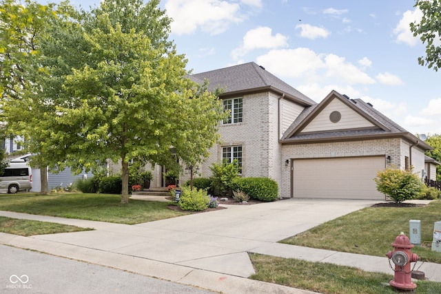 2025 W Morse Dr, Cicero, IN 46034 - view of front of house with brick siding, a garage, concrete driveway, a front lawn, and a shingled roof