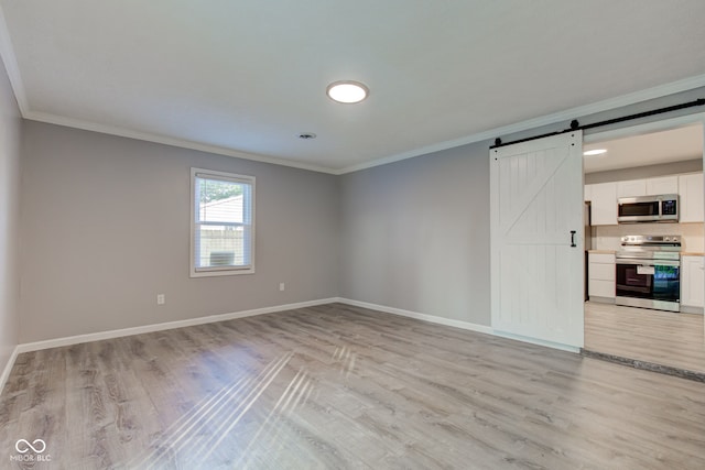 1453 Churchill Rd, Franklin, IN 46131 - unfurnished room with a barn door, crown molding, and light wood-style floors