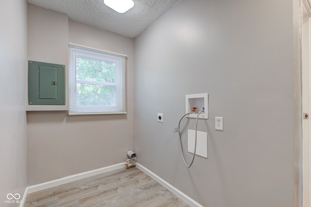 1453 Churchill Rd, Franklin, IN 46131 - laundry room with electric panel, a textured ceiling, hookup for a washing machine, light wood-style floors, and hookup for an electric dryer