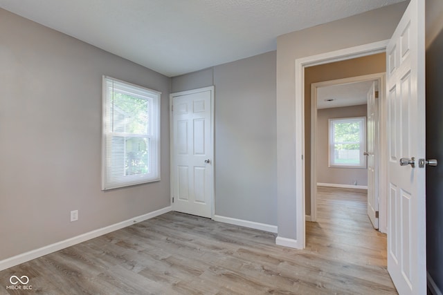 1453 Churchill Rd, Franklin, IN 46131 - unfurnished bedroom with light wood-style flooring and a closet