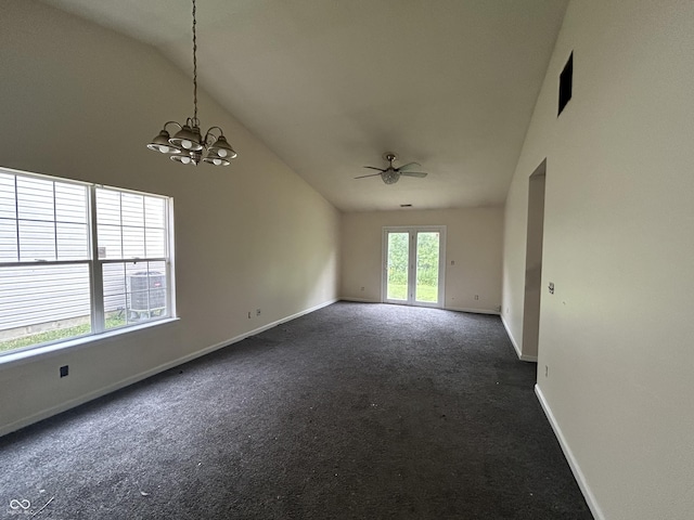 10662 Lostpine Ln, Indianapolis, IN 46235 - spare room with dark carpet, ceiling fan, high vaulted ceiling, and a chandelier