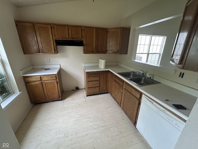 10662 Lostpine Ln, Indianapolis, IN 46235 - kitchen with dishwasher, brown cabinetry, light countertops, and light wood-type flooring