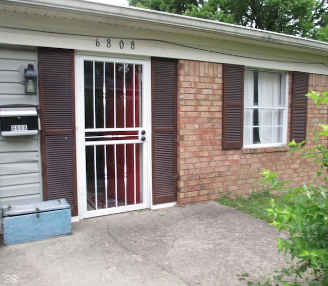 6808 Summer Time Dr, Indianapolis, IN 46226 - property entrance featuring brick siding