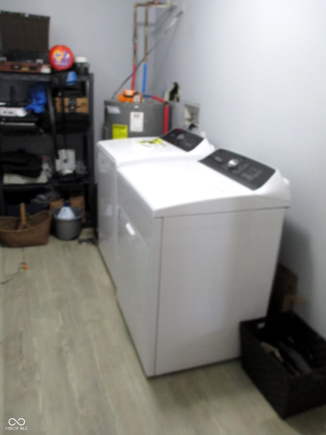 6808 Summer Time Dr, Indianapolis, IN 46226 - washroom with separate washer and dryer and light wood-type flooring