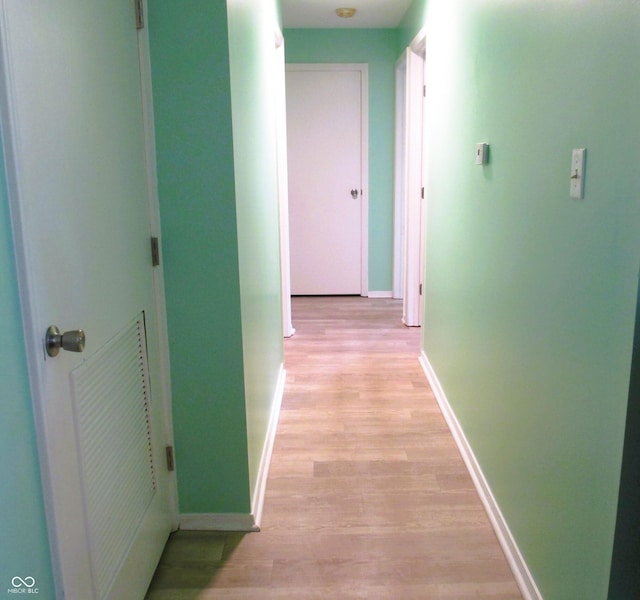 6808 Summer Time Dr, Indianapolis, IN 46226 - hallway featuring light wood-style flooring and baseboards