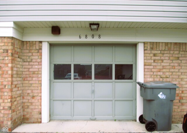 6808 Summer Time Dr, Indianapolis, IN 46226 - property entrance featuring brick siding and a garage