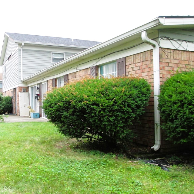 6808 Summer Time Dr, Indianapolis, IN 46226 - view of side of property featuring brick siding and a yard