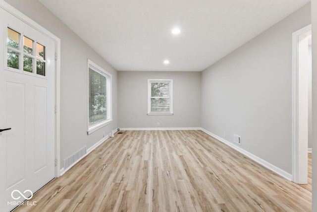 3369 N Chester Ave, Indianapolis, IN 46218 - spare room with light wood-style flooring and recessed lighting