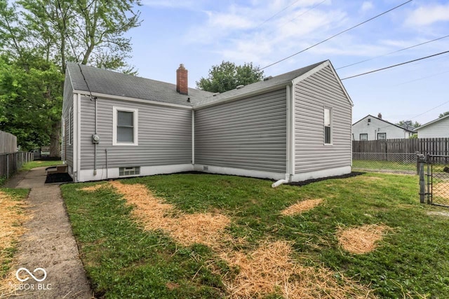 3369 N Chester Ave, Indianapolis, IN 46218 - rear view of house featuring a chimney