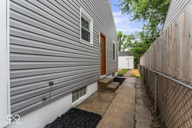 3369 N Chester Ave, Indianapolis, IN 46218 - view of property exterior featuring a fenced backyard and entry steps