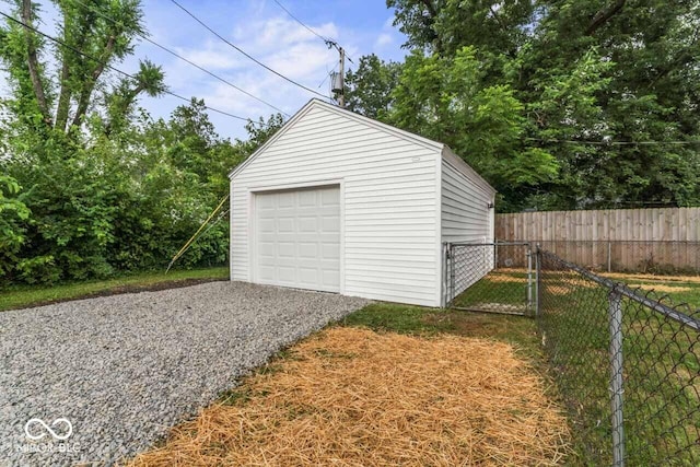3369 N Chester Ave, Indianapolis, IN 46218 - detached garage with gravel driveway