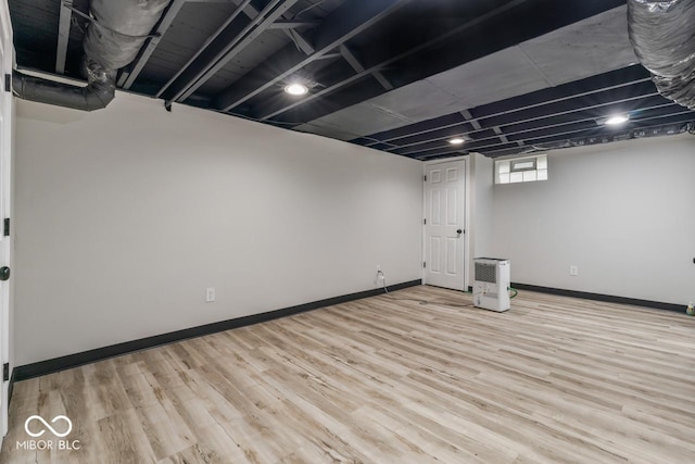 3369 N Chester Ave, Indianapolis, IN 46218 - below grade area with wood finished floors and baseboards
