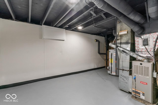 3369 N Chester Ave, Indianapolis, IN 46218 - basement featuring gas water heater and heating unit