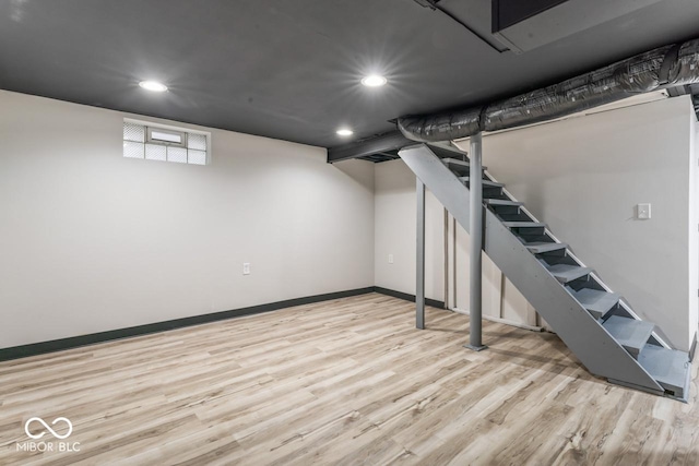 3369 N Chester Ave, Indianapolis, IN 46218 - below grade area with wood finished floors, recessed lighting, and stairs