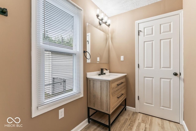 3369 N Chester Ave, Indianapolis, IN 46218 - bathroom featuring vanity and wood finished floors