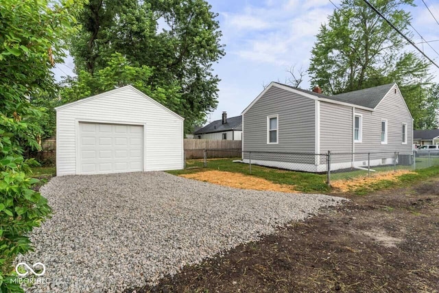 3369 N Chester Ave, Indianapolis, IN 46218 - detached garage featuring driveway