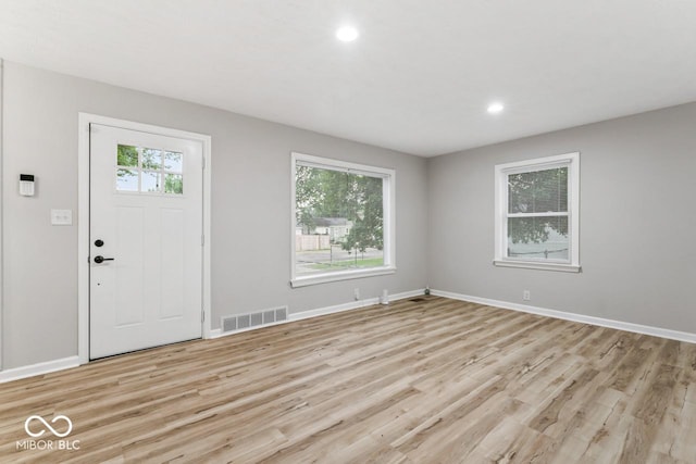 3369 N Chester Ave, Indianapolis, IN 46218 - foyer entrance with light wood finished floors and recessed lighting