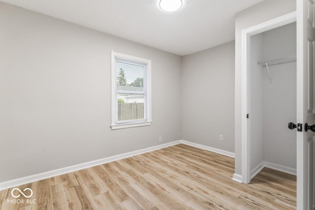 3369 N Chester Ave, Indianapolis, IN 46218 - unfurnished bedroom with a closet and light wood-type flooring