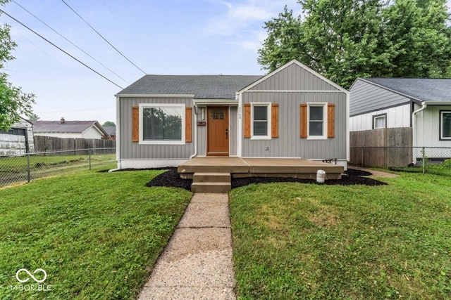 3369 N Chester Ave, Indianapolis, IN 46218 - view of front facade featuring a shingled roof and a fenced backyard