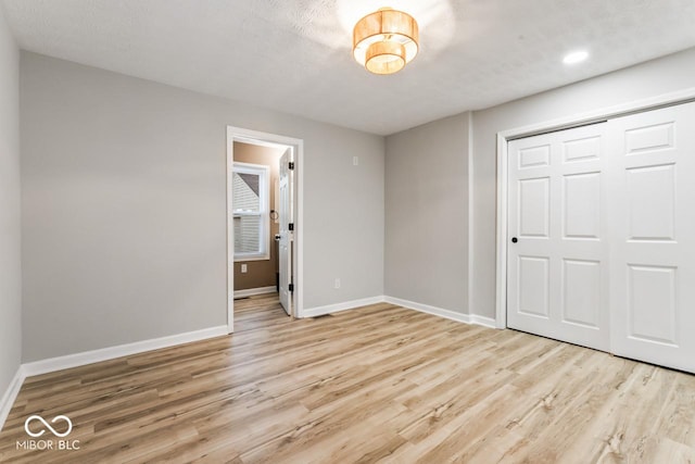 3369 N Chester Ave, Indianapolis, IN 46218 - unfurnished bedroom with wood finished floors and a closet