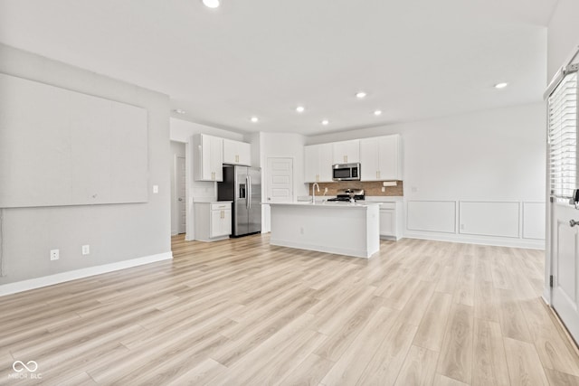 7239 Governors Row, Avon, IN 46123 - kitchen with stainless steel appliances, open floor plan, white cabinets, recessed lighting, and an island with sink