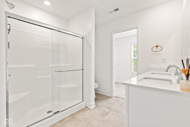 7239 Governors Row, Avon, IN 46123 - bathroom with double vanity, a shower stall, tile patterned flooring, and recessed lighting