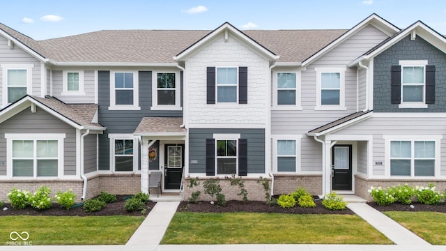 7239 Governors Row, Avon, IN 46123 - multi unit property with brick siding, a front lawn, and a shingled roof