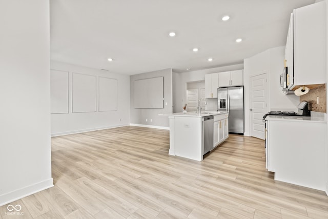 7239 Governors Row, Avon, IN 46123 - kitchen featuring appliances with stainless steel finishes, recessed lighting, a center island with sink, light countertops, and open floor plan