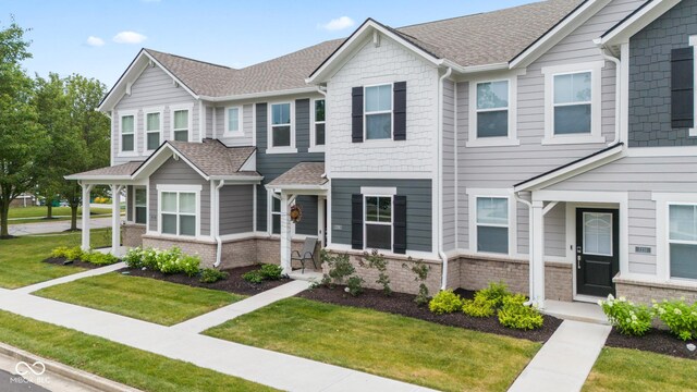 7239 Governors Row, Avon, IN 46123 - townhome / multi-family property with a front yard and roof with shingles