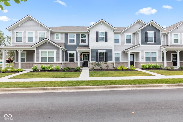 7239 Governors Row, Avon, IN 46123 - multi unit property with brick siding and a front lawn